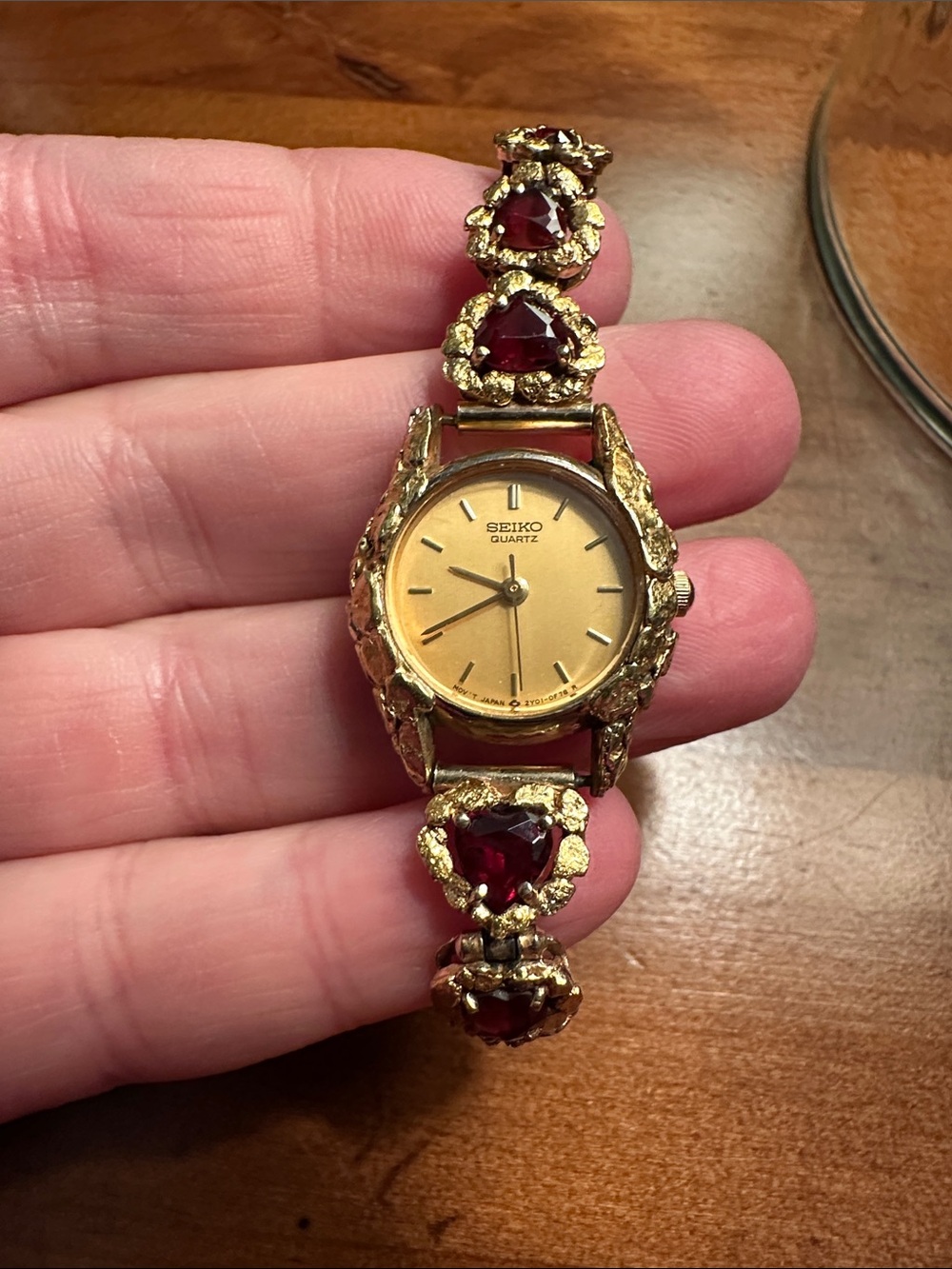 Seiko Gold Women's Bracelet Watch with Red Heart Gem Accents
